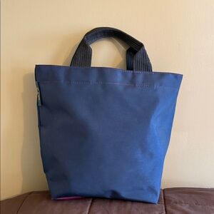 Hervé Chapelier Navy Tote Bag with Black Handles and magenta base. EUC